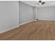 This room has hardwood floors and light gray walls at 1235 King Springs Se Ct, Smyrna, GA 30080