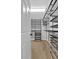 This walk-in closet includes custom shelving and ample storage space, creating an organized area at 1235 King Springs Se Ct, Smyrna, GA 30080