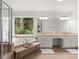 Bright bathroom features a soaking tub, a large window with wooded views, and double sinks at 203 Northside Nw Dr, Kennesaw, GA 30144