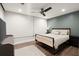Modern bedroom features a ceiling fan, laminate flooring, and a sleek design at 203 Northside Nw Dr, Kennesaw, GA 30144