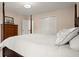 Comfortable bedroom featuring a four poster bed, closet, and wood dresser at 203 Northside Nw Dr, Kennesaw, GA 30144