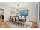 Elegant dining room with modern chandelier and seating for eight people at 203 Northside Nw Dr, Kennesaw, GA 30144