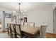 Cozy dining room featuring a large table, chandelier, and wood floors at 203 Northside Nw Dr, Kennesaw, GA 30144