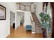 Bright foyer with hardwood floors, staircase, and an upper level view at 203 Northside Nw Dr, Kennesaw, GA 30144