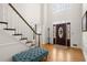 Grand foyer featuring high ceilings, a staircase, and a decorative front door at 203 Northside Nw Dr, Kennesaw, GA 30144