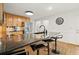 Kitchen island with granite countertop, seating, and a stainless steel refrigerator in this well-lit kitchen space at 203 Northside Nw Dr, Kennesaw, GA 30144