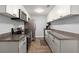 Updated kitchen with stainless steel appliances, granite countertops, and white cabinets at 203 Northside Nw Dr, Kennesaw, GA 30144