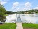 Scenic lake view featuring a charming gazebo, serene water, and lush green surroundings, enhancing the property's appeal at 203 Northside Nw Dr, Kennesaw, GA 30144