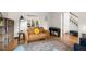 Comfortable living room area featuring stylish decor, a piano, and neutral colors at 203 Northside Nw Dr, Kennesaw, GA 30144