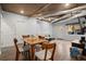 Open-concept living room with exposed ductwork, wood floors, and an adjacent dining area at 203 Northside Nw Dr, Kennesaw, GA 30144