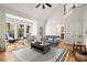 Open living room with high ceilings, large bay window and hardwood floors with plenty of natural light at 203 Northside Nw Dr, Kennesaw, GA 30144