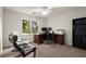 Home office space with a large window, wooden desk, and comfortable chairs at 203 Northside Nw Dr, Kennesaw, GA 30144