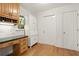 Home office featuring a built-in desk, cabinets, drawers, and hardwood floors at 203 Northside Nw Dr, Kennesaw, GA 30144