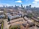 Stunning aerial view of the complex highlighting the downtown skyline and community pool at 3475 Landen Pine Ne Ct, Atlanta, GA 30305