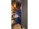 Chic bar area with custom cabinetry, beverage cooler, and metallic accents at 3475 Landen Pine Ne Ct, Atlanta, GA 30305