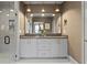 Bathroom featuring a double sink vanity, stylish lighting, and glass enclosed shower at 3475 Landen Pine Ne Ct, Atlanta, GA 30305