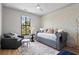 Comfortable bedroom with a daybed, sitting area, and a serene view from the window at 3475 Landen Pine Ne Ct, Atlanta, GA 30305