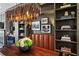 Modern dining room featuring a statement chandelier, built-in shelving, and leather bench seating at 3475 Landen Pine Ne Ct, Atlanta, GA 30305