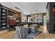 Bright and airy dining area features hardwood floors, built-in bookshelves, and a unique chandelier at 3475 Landen Pine Ne Ct, Atlanta, GA 30305