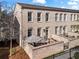 Brick townhouse with an inviting gated front patio, ideal for relaxing and entertaining at 3475 Landen Pine Ne Ct, Atlanta, GA 30305