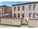 Charming brick townhome features a gated front entrance, manicured lawn, and a secure, inviting facade at 3475 Landen Pine Ne Ct, Atlanta, GA 30305