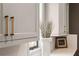 Modern kitchen featuring light gray cabinets, gold hardware, and a decorative vase with branches next to a window at 3475 Landen Pine Ne Ct, Atlanta, GA 30305