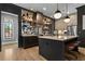 Modern kitchen with a center island, pendant lights, and mirrored backsplash at 3475 Landen Pine Ne Ct, Atlanta, GA 30305