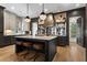 Elegant kitchen with an island, modern pendant lighting, and stainless steel appliances at 3475 Landen Pine Ne Ct, Atlanta, GA 30305