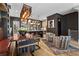 Spacious living and dining area with hardwood floors, modern lighting, and stylish furnishings at 3475 Landen Pine Ne Ct, Atlanta, GA 30305