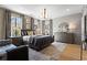 Serene main bedroom featuring hardwood floors, large windows, designer lighting, and elegant furnishings at 3475 Landen Pine Ne Ct, Atlanta, GA 30305