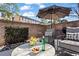 Charming patio featuring a seating area, umbrella, and flowers, creating a cozy outdoor retreat at 3475 Landen Pine Ne Ct, Atlanta, GA 30305