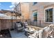 Comfortable outdoor seating on a patio with room to grill and views of the surrounding community at 3475 Landen Pine Ne Ct, Atlanta, GA 30305