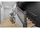 Elegant staircase with gray trim, light wood treads, and a dark accent wall leads to the upper level at 3475 Landen Pine Ne Ct, Atlanta, GA 30305