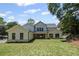 Beautiful backyard view of the house with lush green lawn at 372 Karen Dr, Alpharetta, GA 30009