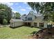 Large backyard featuring a well-manicured lawn and mature trees at 372 Karen Dr, Alpharetta, GA 30009