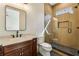 Bathroom with dark wood vanity and a glass shower with a built in bench at 372 Karen Dr, Alpharetta, GA 30009