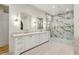 Elegant bathroom featuring double vanity with gold fixtures and a spacious marble shower at 372 Karen Dr, Alpharetta, GA 30009