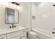 Bathroom featuring a white vanity, and a shower/tub with white herringbone tiles at 372 Karen Dr, Alpharetta, GA 30009