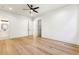 Bright bedroom with hardwood floors, ceiling fan, and ensuite bath access at 372 Karen Dr, Alpharetta, GA 30009