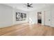 Bright bedroom showcases hardwood floors, a ceiling fan, and neighborhood views at 372 Karen Dr, Alpharetta, GA 30009