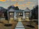 Stunning two-story home with meticulous landscaping and a welcoming entrance at 372 Karen Dr, Alpharetta, GA 30009