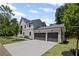 Attached two-car garage with ample parking space and manicured landscaping at 372 Karen Dr, Alpharetta, GA 30009