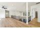Upstairs hallway with hardwood floors, recessed lighting, and staircase with black metal spindles at 372 Karen Dr, Alpharetta, GA 30009