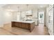 Modern kitchen features a large island, stainless steel appliances, custom cabinetry, and pendant lighting at 372 Karen Dr, Alpharetta, GA 30009