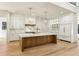 Gourmet kitchen with marble countertops, wooden island, and modern cabinetry at 372 Karen Dr, Alpharetta, GA 30009