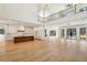 Open-concept living space with a modern kitchen, wood flooring, and soaring ceilings at 372 Karen Dr, Alpharetta, GA 30009