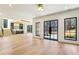 Open-concept living room featuring beautiful hardwood floors, staircase and exterior view at 372 Karen Dr, Alpharetta, GA 30009