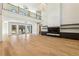 Bright open living room featuring floor-to-ceiling fireplace, hardwood floors and open concept at 372 Karen Dr, Alpharetta, GA 30009