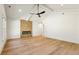 Spacious living room with hardwood floors, fireplace, ceiling fan, and bright natural light at 372 Karen Dr, Alpharetta, GA 30009