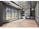 Bright living room boasts hardwood floors, built-in shelving, fireplace, and large windows offering a scenic view at 372 Karen Dr, Alpharetta, GA 30009